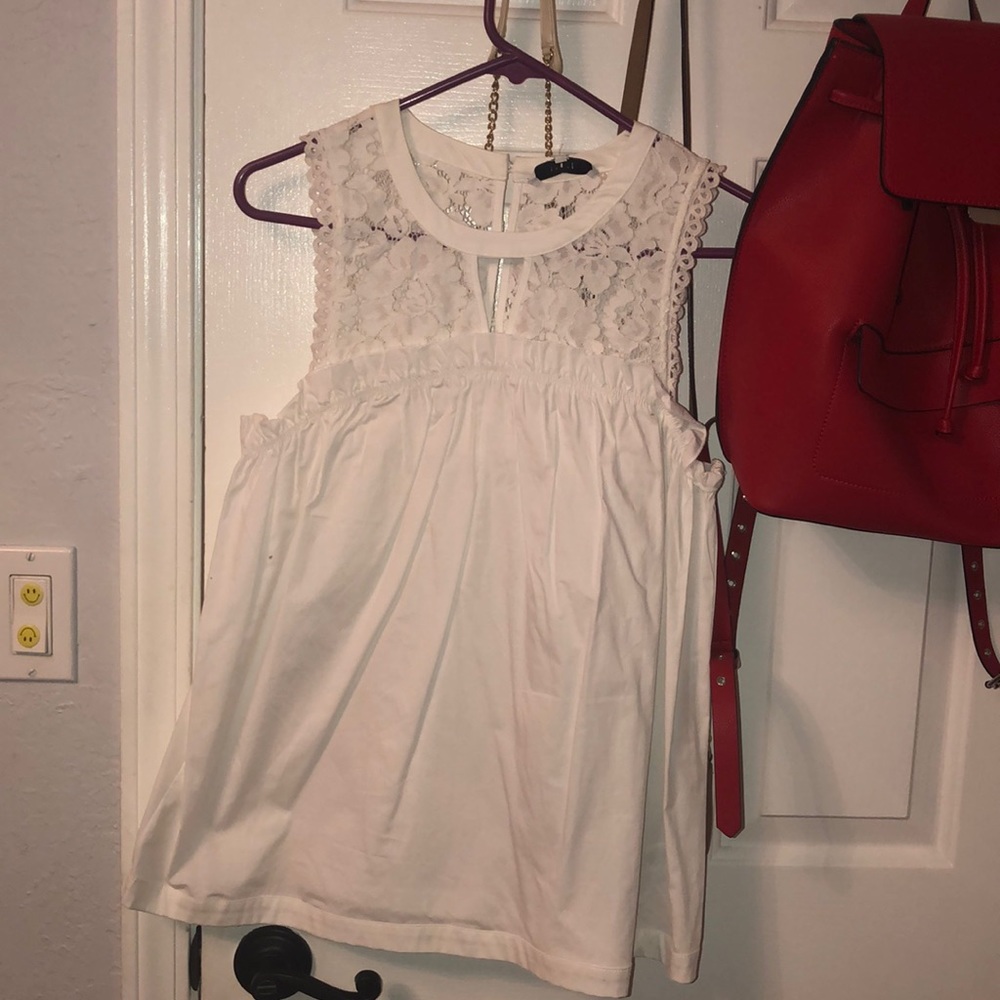 A white lace shirt , goes great with jeans .